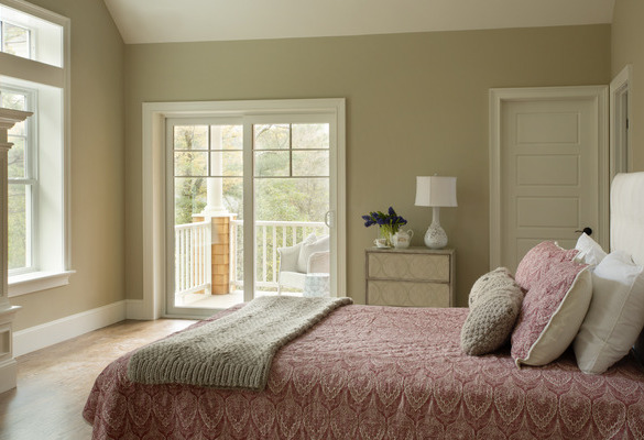 Vinyl sliding patio door letting light into a bedroom
